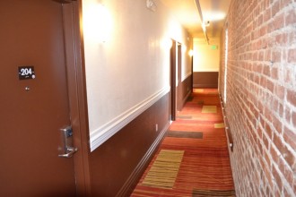 Inn on Folsom - Hallway with a Brick Wall